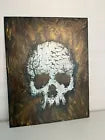 Acrylic on canvas white skeleton head in black and gold color background